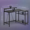 HOMCOM L Shaped Gaming Desk with LED Lights, Power Outlet, USB Charging Ports, 107cm Reversible Corner Computer Desk with Storage Shelves, Monitor Stand for Home Office, Small Space, Black