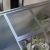 Outsunny 6 x 8ft Polycarbonate Greenhouse with Rain Gutters, Large Walk-In Green House with Door and Window, Garden Plants Grow House with Aluminium Frame and Foundation