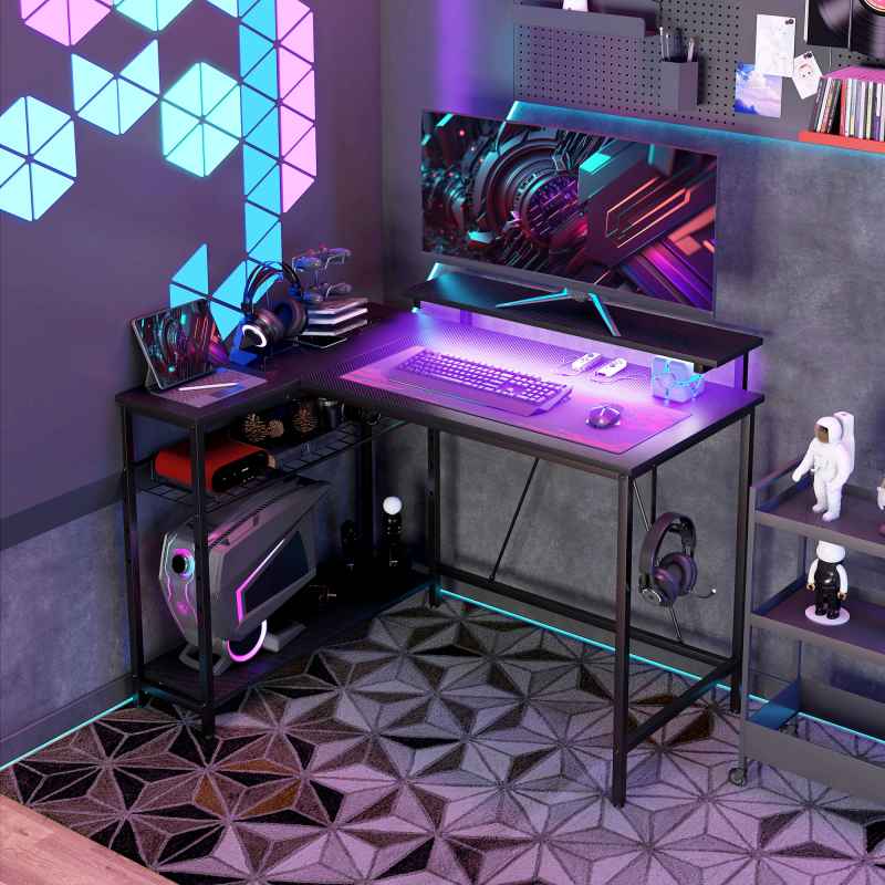 HOMCOM L Shaped Gaming Desk with LED Lights, Power Outlet, USB Charging Ports, 107cm Reversible Corner Computer Desk with Storage Shelves, Monitor Stand for Home Office, Small Space, Black